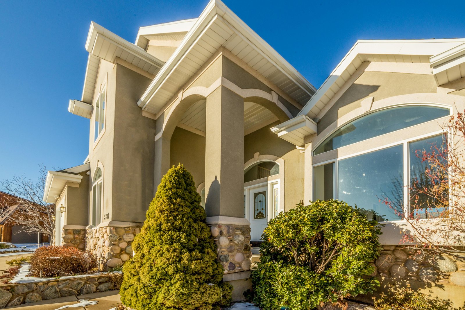 Daytime exterior of a home before twilight editing